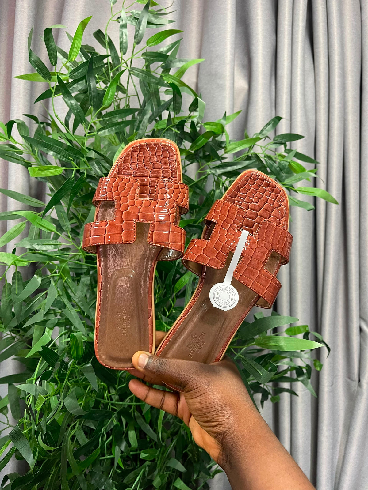 Boxed brown hermes slippers