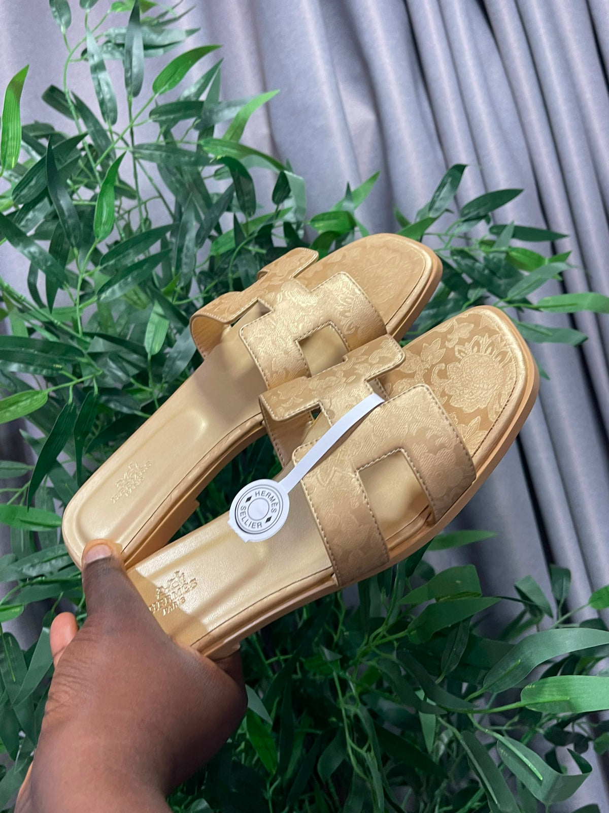 Boxed gold hermes slippers